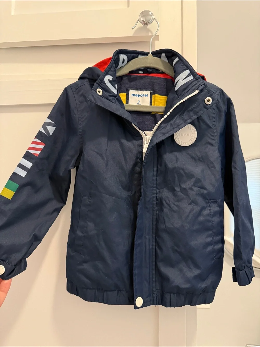 Mayoral Navy Hooded Raincoat with Colorful Sleeve Flags